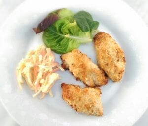 Almond and parmesan chicken with salad and coleslaw