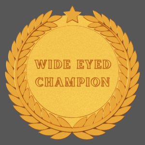 gold medal with wide eyed champion in the middle on a dark grey background