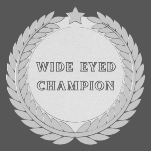 silver medal with wide eyed champion in the middle on a dark grey background